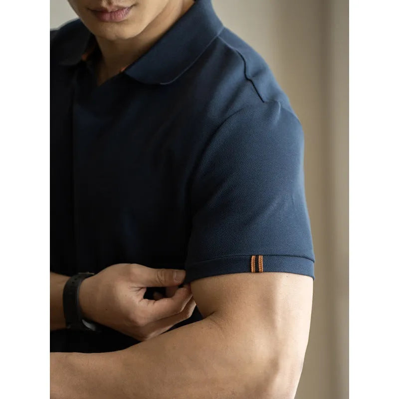 Blue cotton polyester blend short-sleeved polo shirt on a hanger, showing regular fit and casual style.