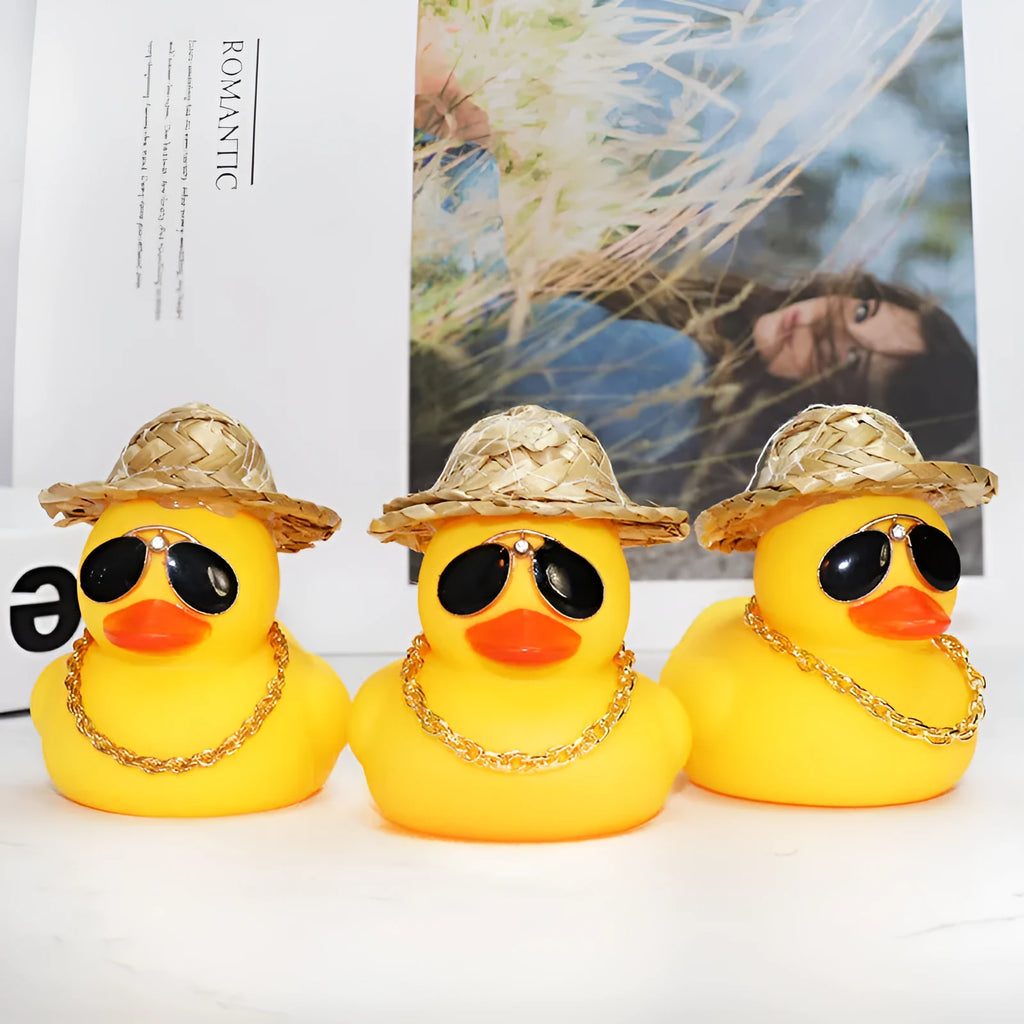 Yellow duck cartoon character wearing straw hat car dashboard ornament with sunglasses and necklace accessories
