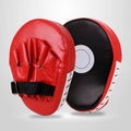 A pair of PU punch mitts for boxing and Muay Thai training, shown in a red edge and black surface colour variant.
