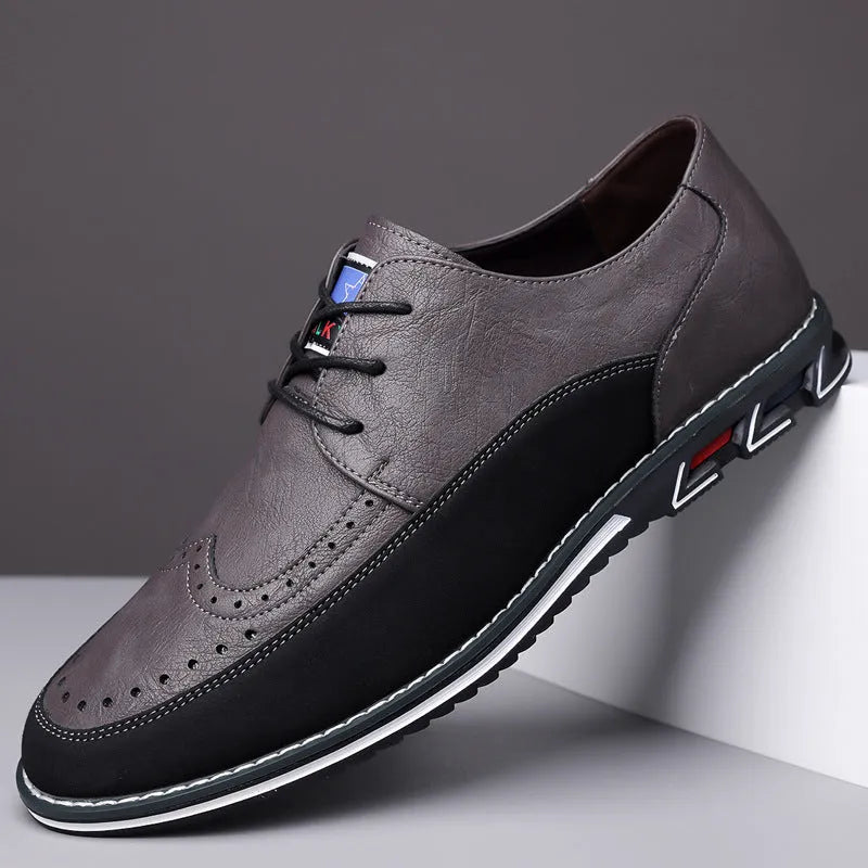 Men's leather slip-on shoes in black, grey, khaki and orange colours with rubber soles and low-top design