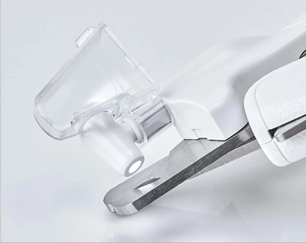 White pet nail clippers with LED light, transparent anti-splash guard and triangular blade for dogs and cats