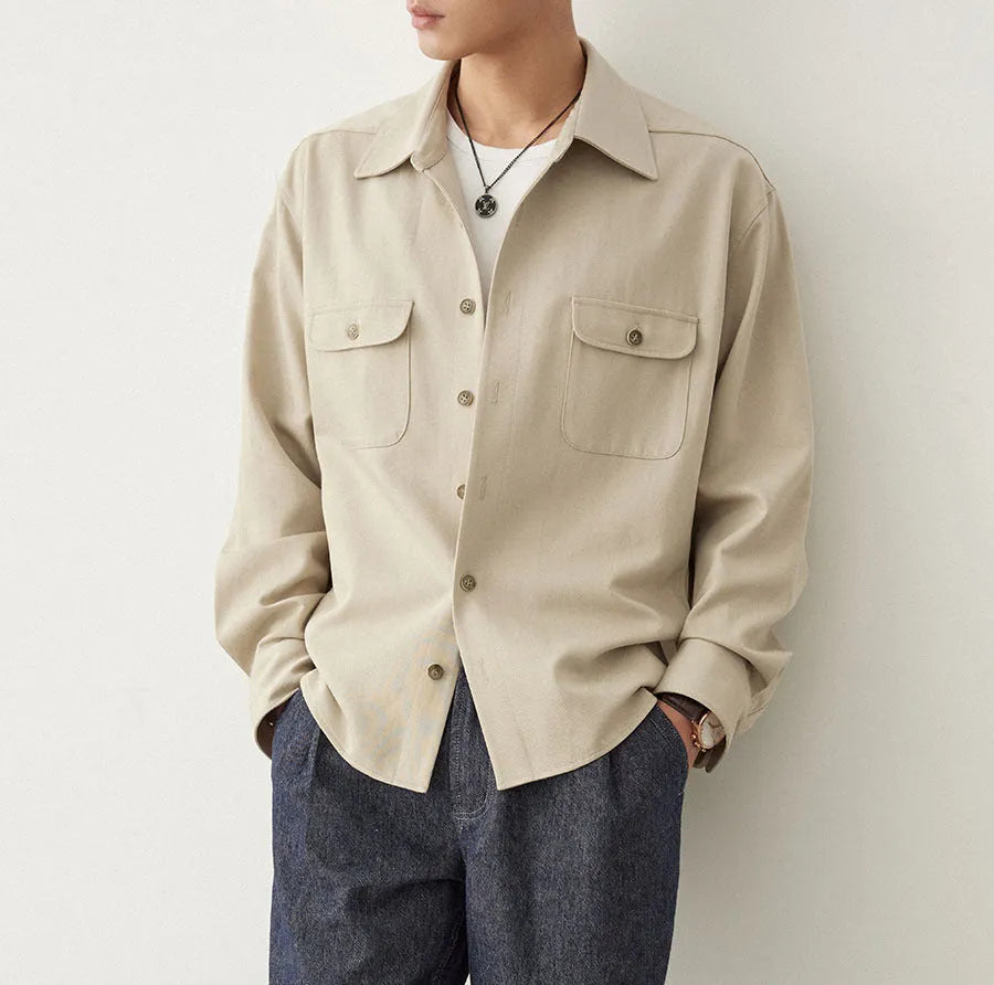 Men's light sand rice coloured long sleeve shirt with a lapel collar, laid flat to show front design.