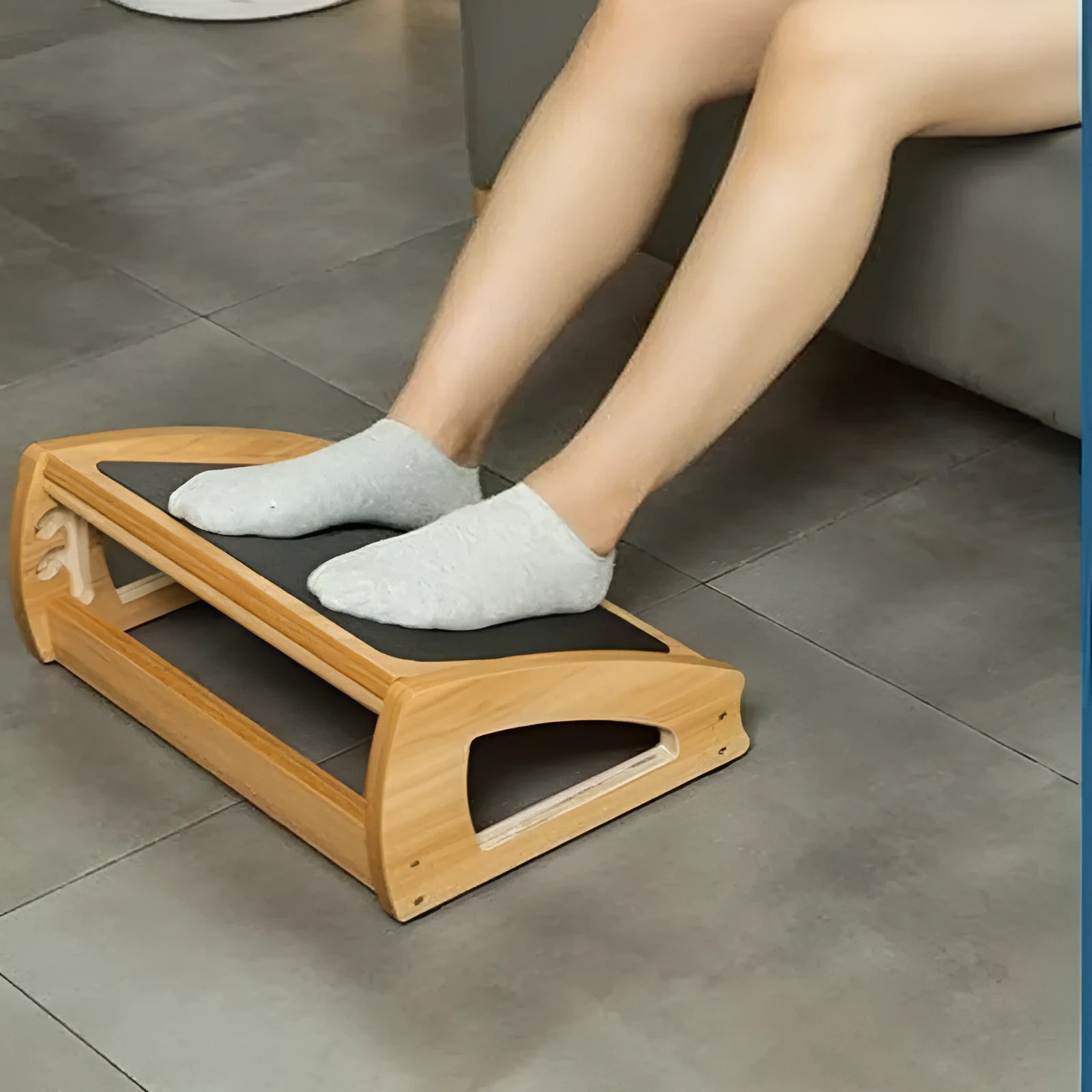 Wooden bamboo adjustable office desk footstool in natural wood colour, showing modern minimalist design.