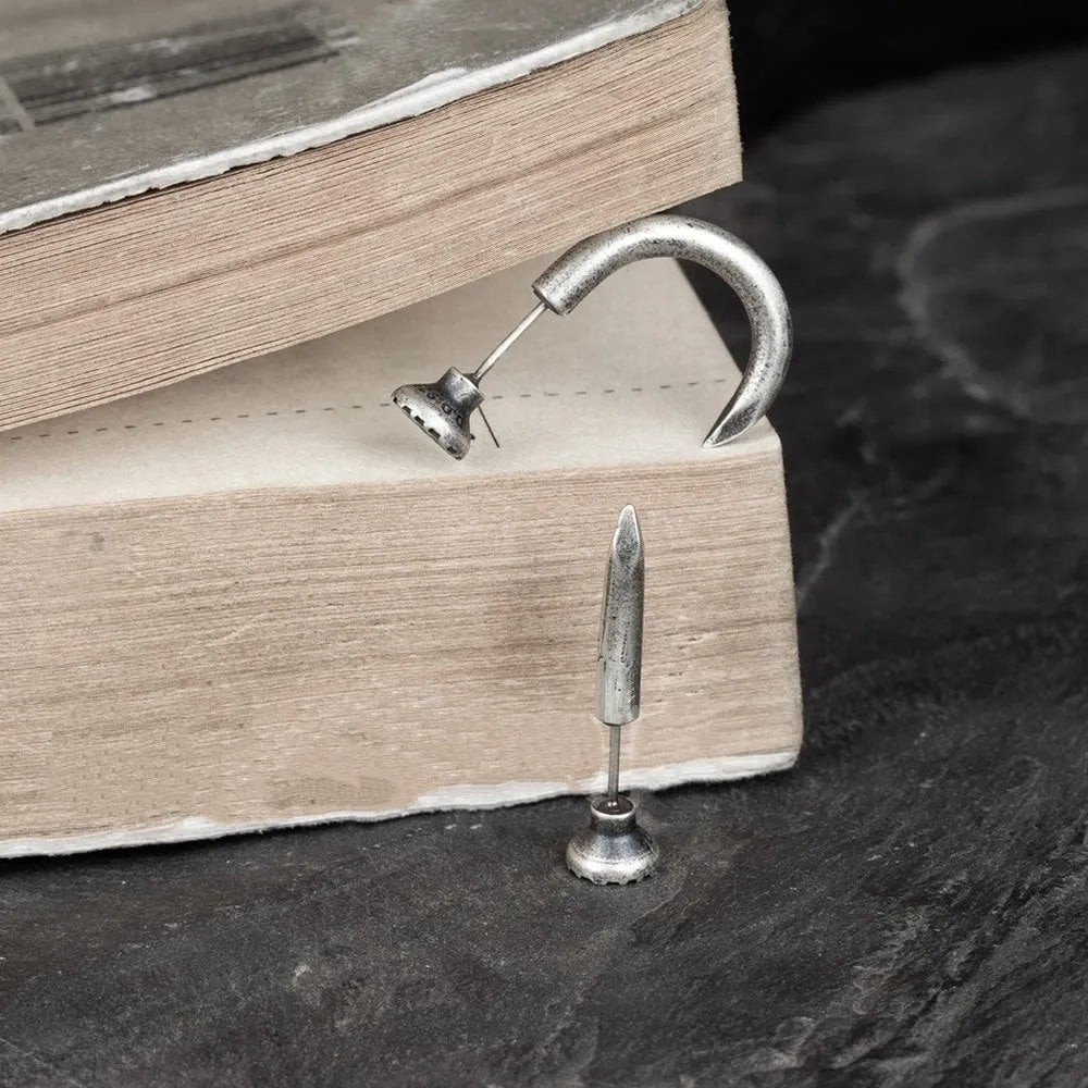 S925 sterling silver punk stud earring in a retro straight or curved nail design on an ear hook.