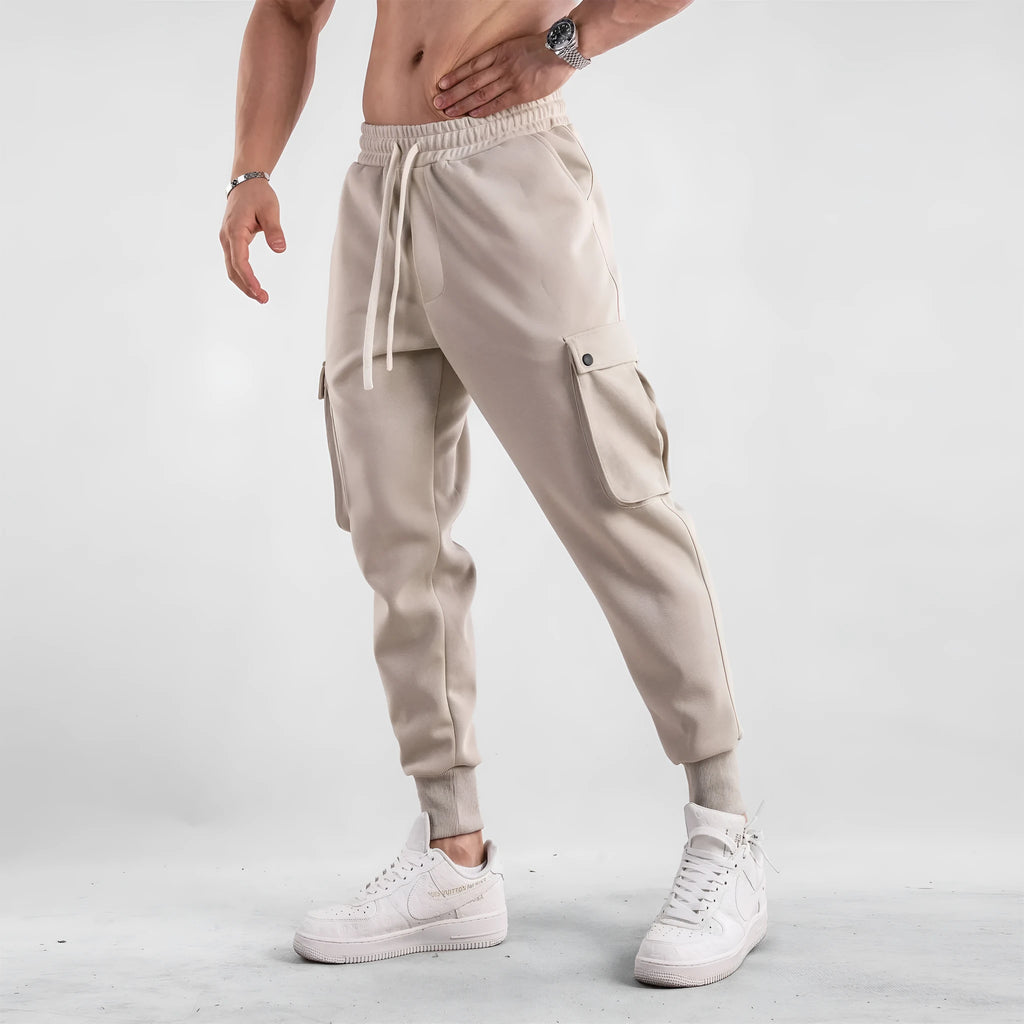 Men's loose cotton trousers with ankle tie fastening and multiple pockets in six colour options