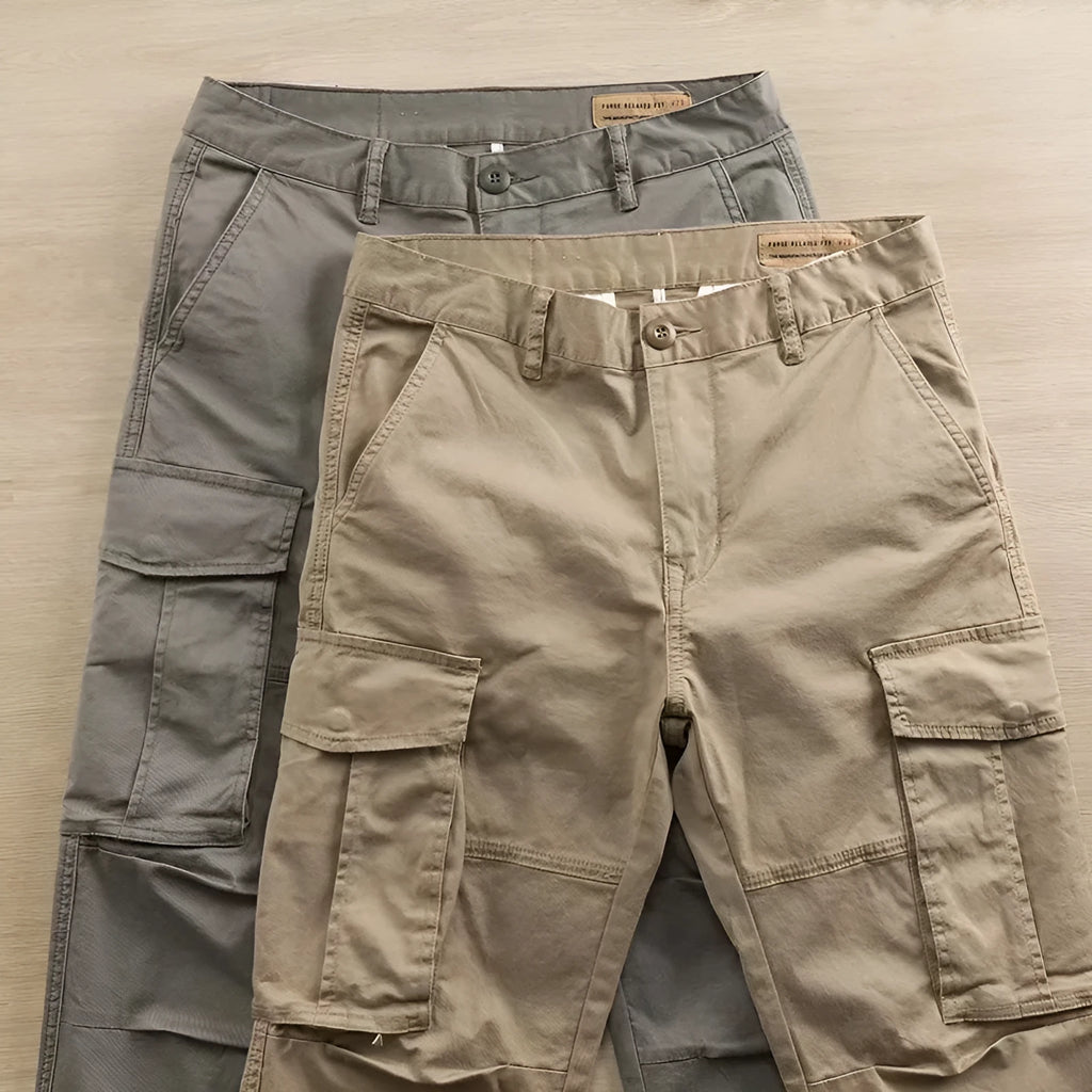 Man wearing khaki coloured multi-pocket cotton cropped work trousers.