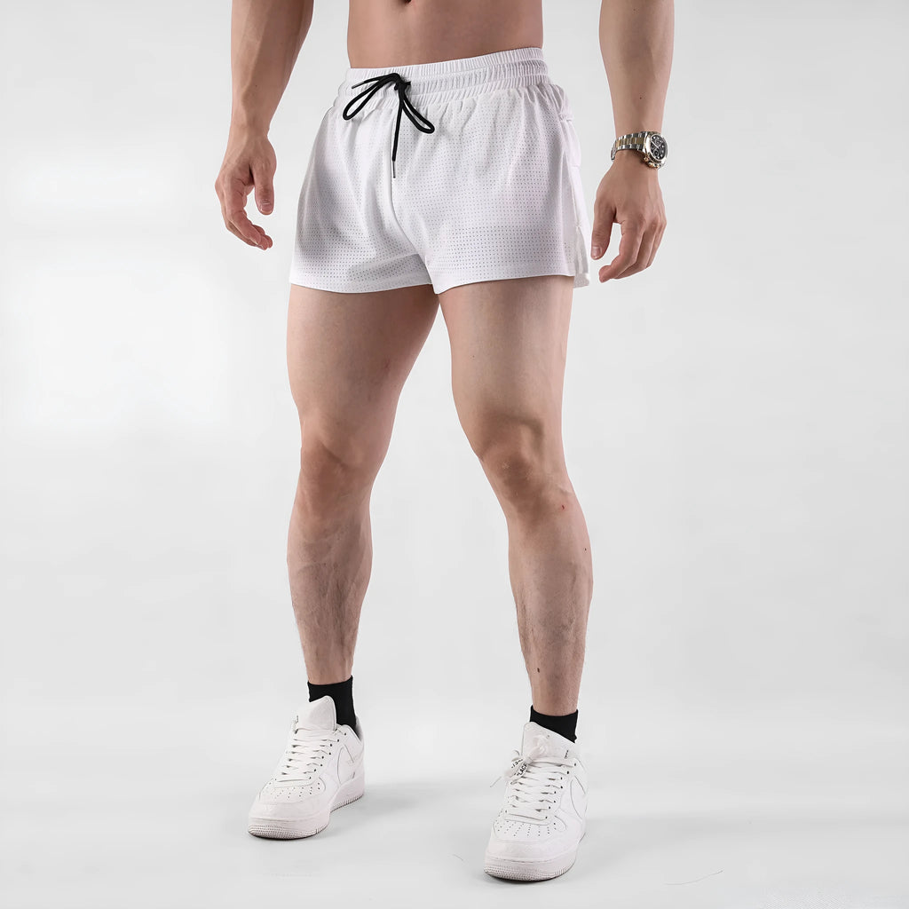 Man wearing black quick-dry nylon summer shorts, showing mid-waist sports leisure style.