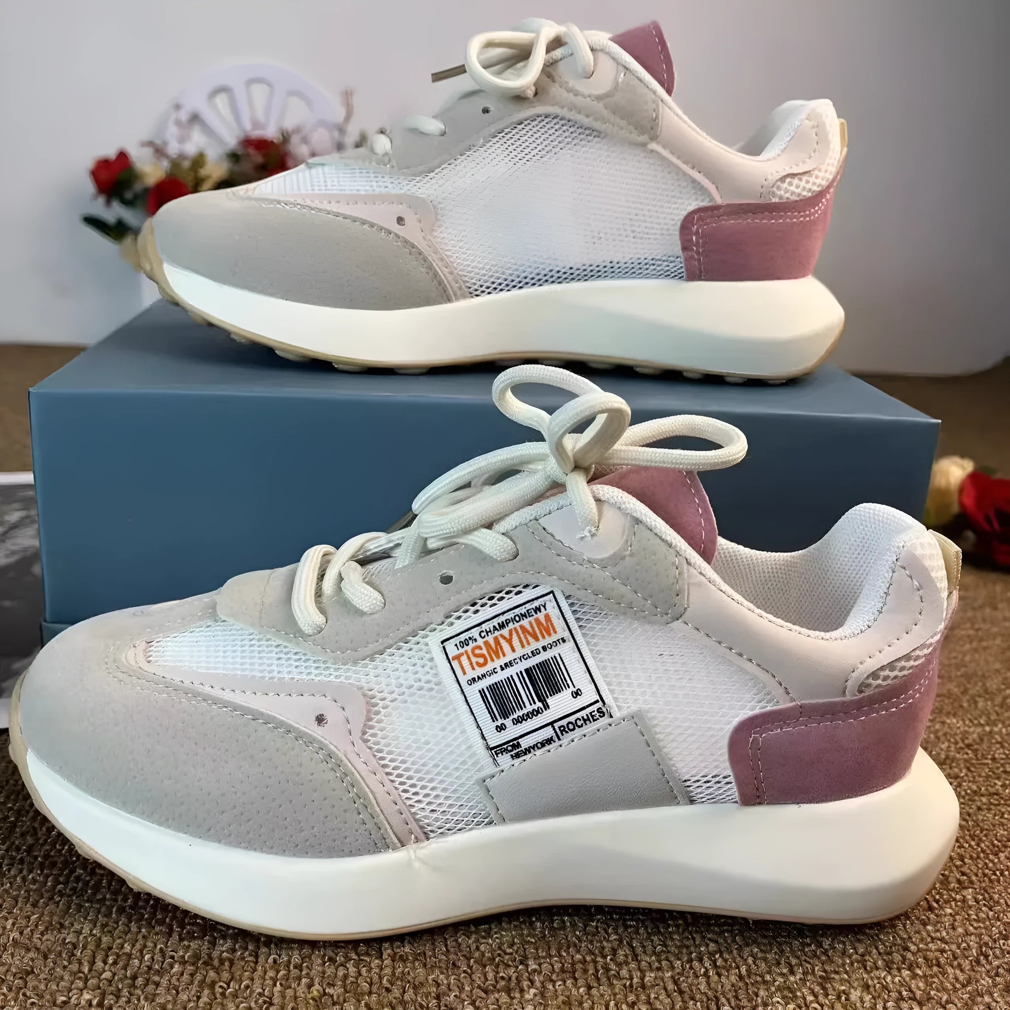 Women's grey retro sneaker with low-top design, mesh lining, and rubber sole