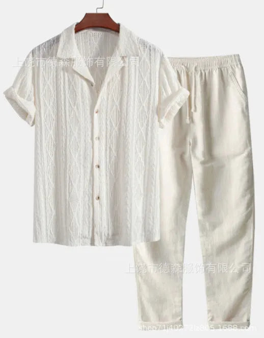 Man wearing a loose-fit light blue short sleeve shirt and matching trousers from a milk silk summer suit.