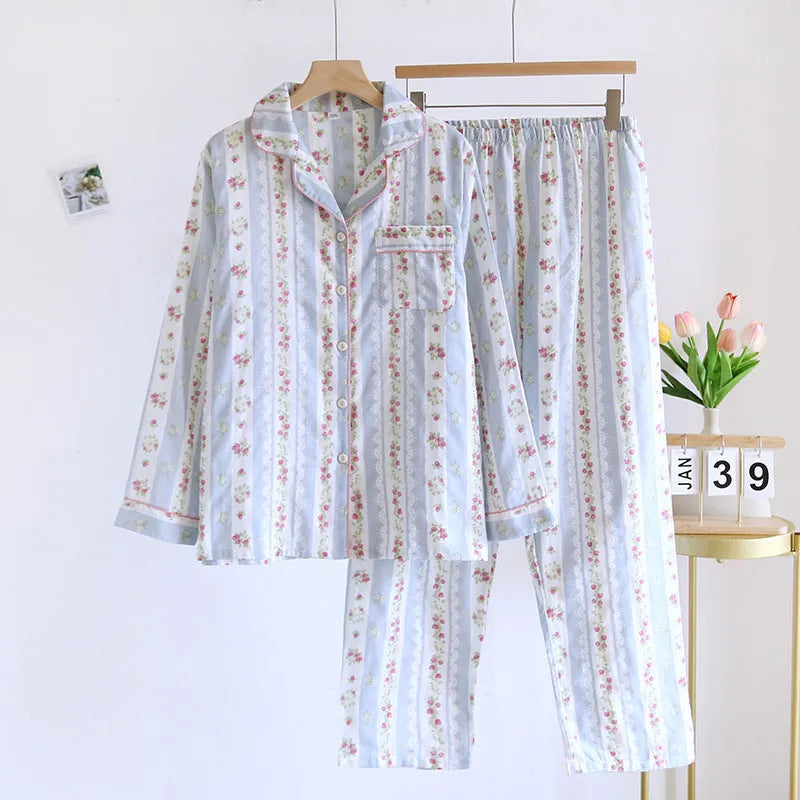 Women's striped cotton gauze long-sleeved top and matching trousers two-piece lounge set laid flat.