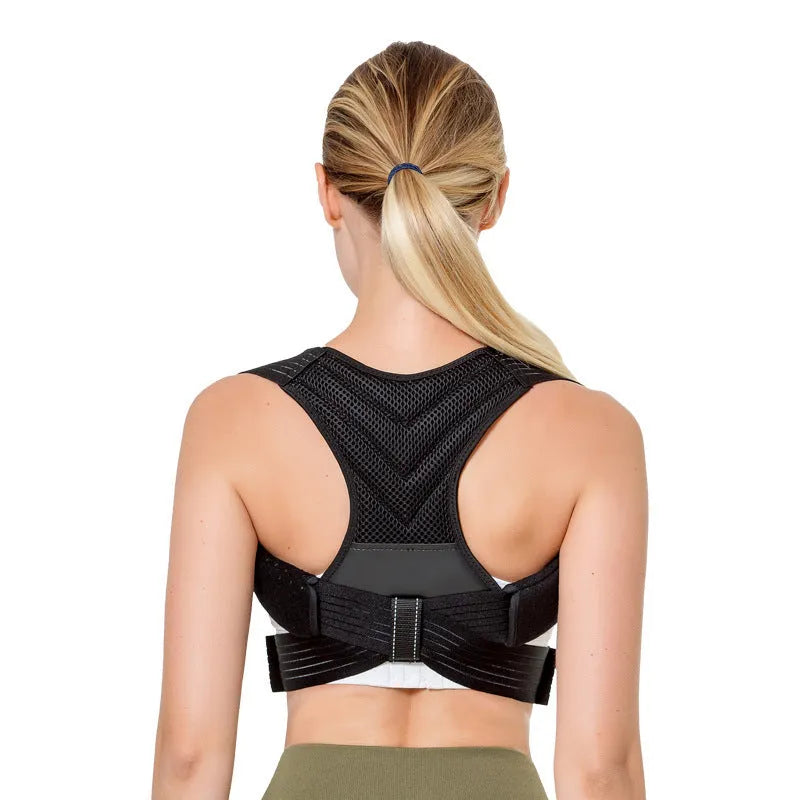 Black posture correction belt with open shoulder design shown on model