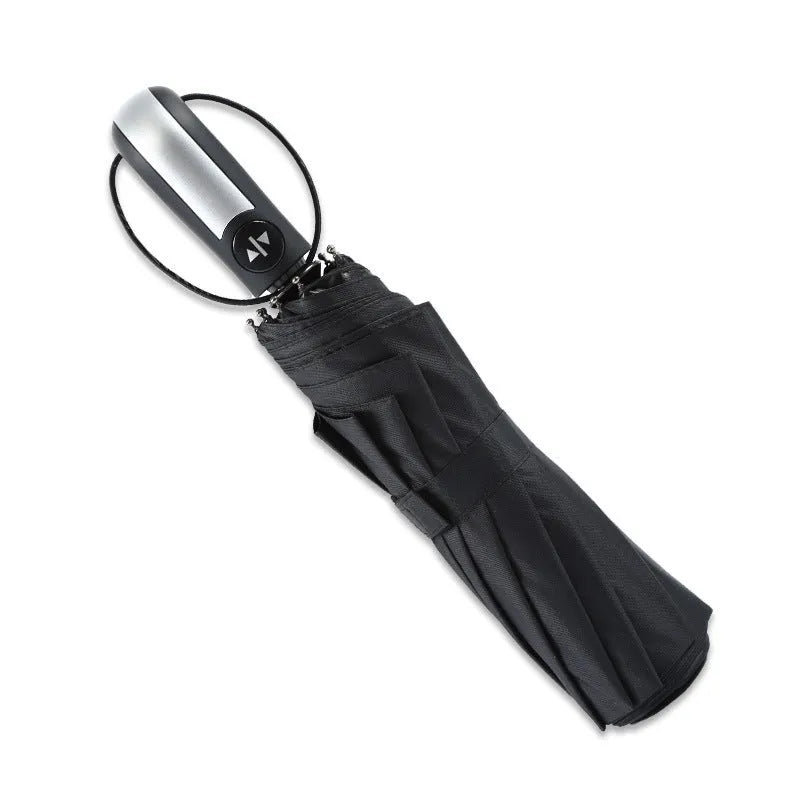 Triple-fold automatic open business umbrella in black, showing palace-style shape and rubber handle.