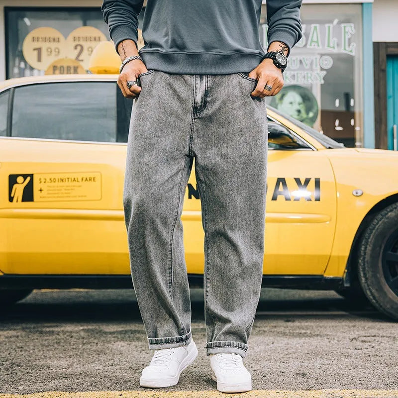Men's loose straight cotton jeans in dark blue, light blue, and grey colours with mid-rise waist