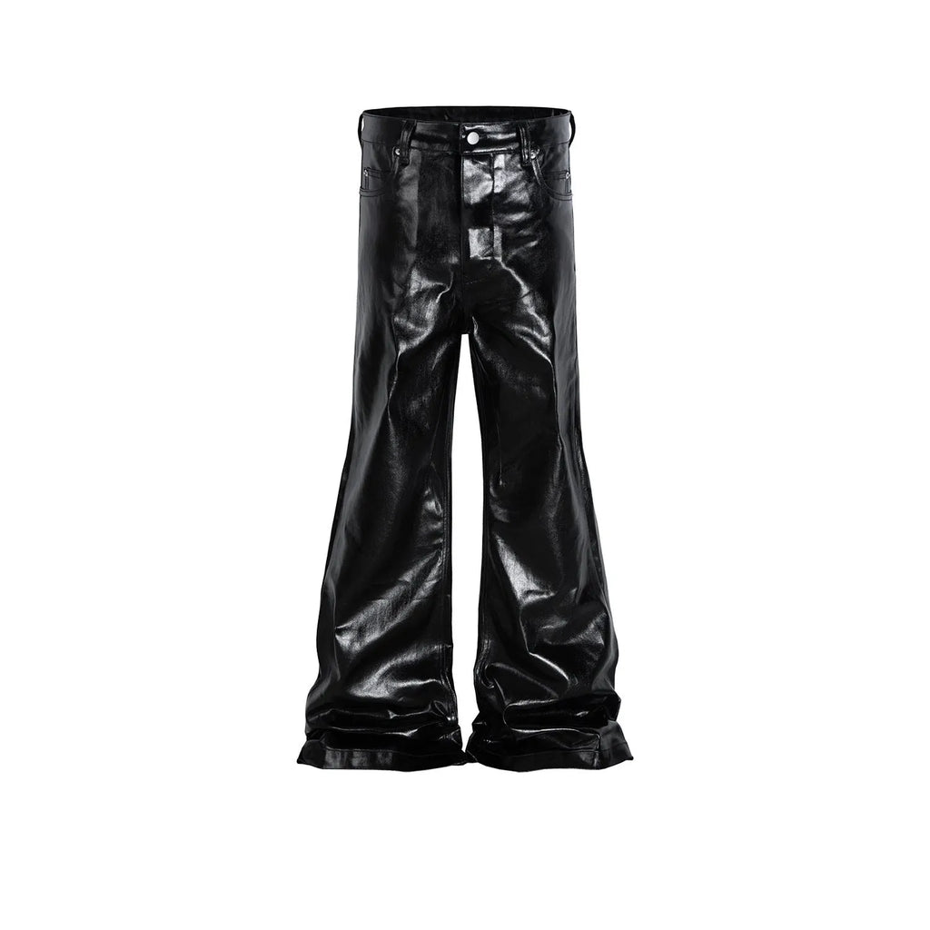 Black coated patent leather skinny jeans in a straight-leg cut on a model.