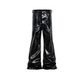 Black coated patent leather skinny jeans in a straight-leg cut on a model.
