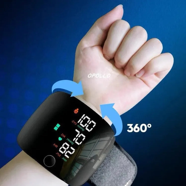 Black wrist blood pressure monitor with digital display and USB charging port