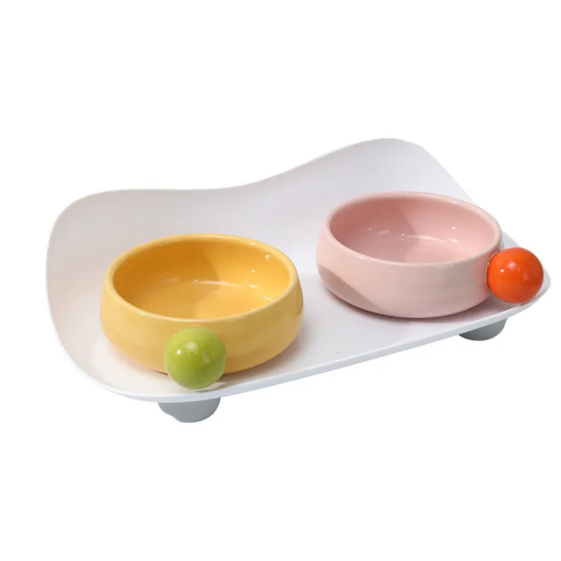 Ceramic double-raised cat bowl set in pink, yellow, or pink yellow with non-slip base