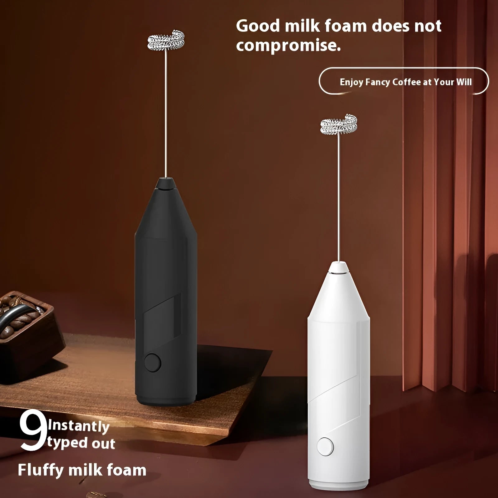 Black handheld electric milk frother with stainless steel whisk and USB charging port