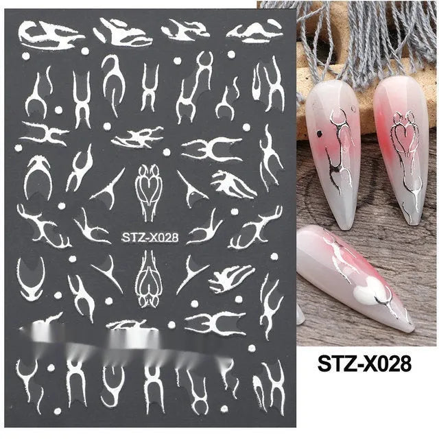 Sheet of black and silver stripe nail art stickers from a cartoon series for DIY manicures.