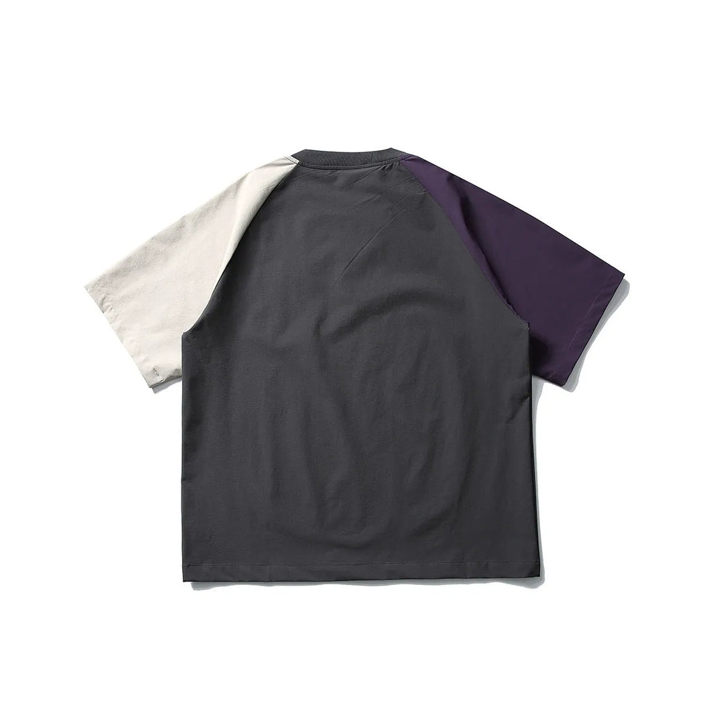 Dark grey men's loose fit t-shirt with contrasting colour panels on the raglan sleeves.