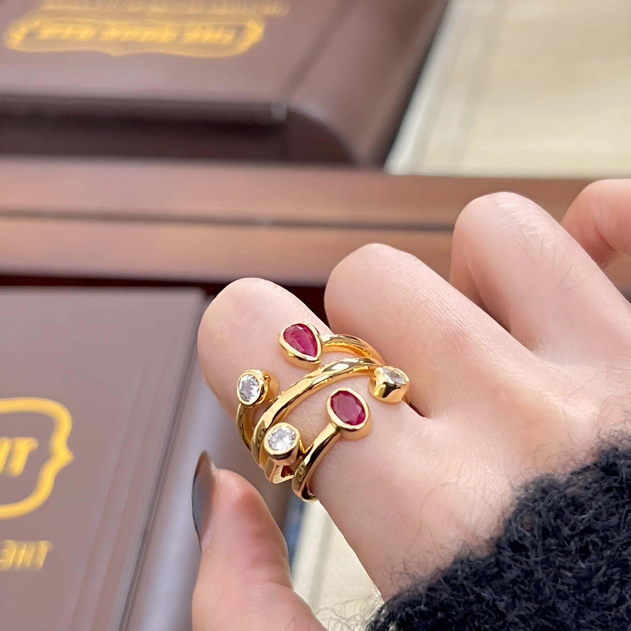 Irregular cross geometric ring with double-headed diamonds and two-tone colour finish