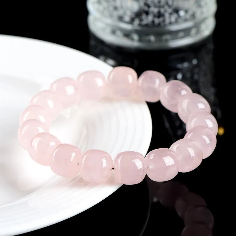 Pink bamboo crystal barrel bead bracelet with 11-12mm geometric beads on wrist