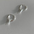 Women's geometric star-shaped ear clip with an electroplated platinum or white gold finish.