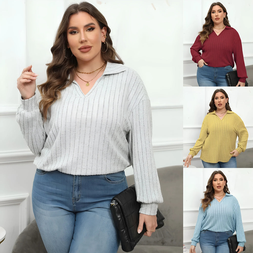 Women's plus size gray fleece pullover with a polo collar and full lantern sleeves.