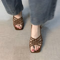 Retro women's sandals with thin cross straps, square toe and ankle buckle in light brown