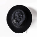 Handmade wool skull hat with conical crown design for Halloween and costume wear