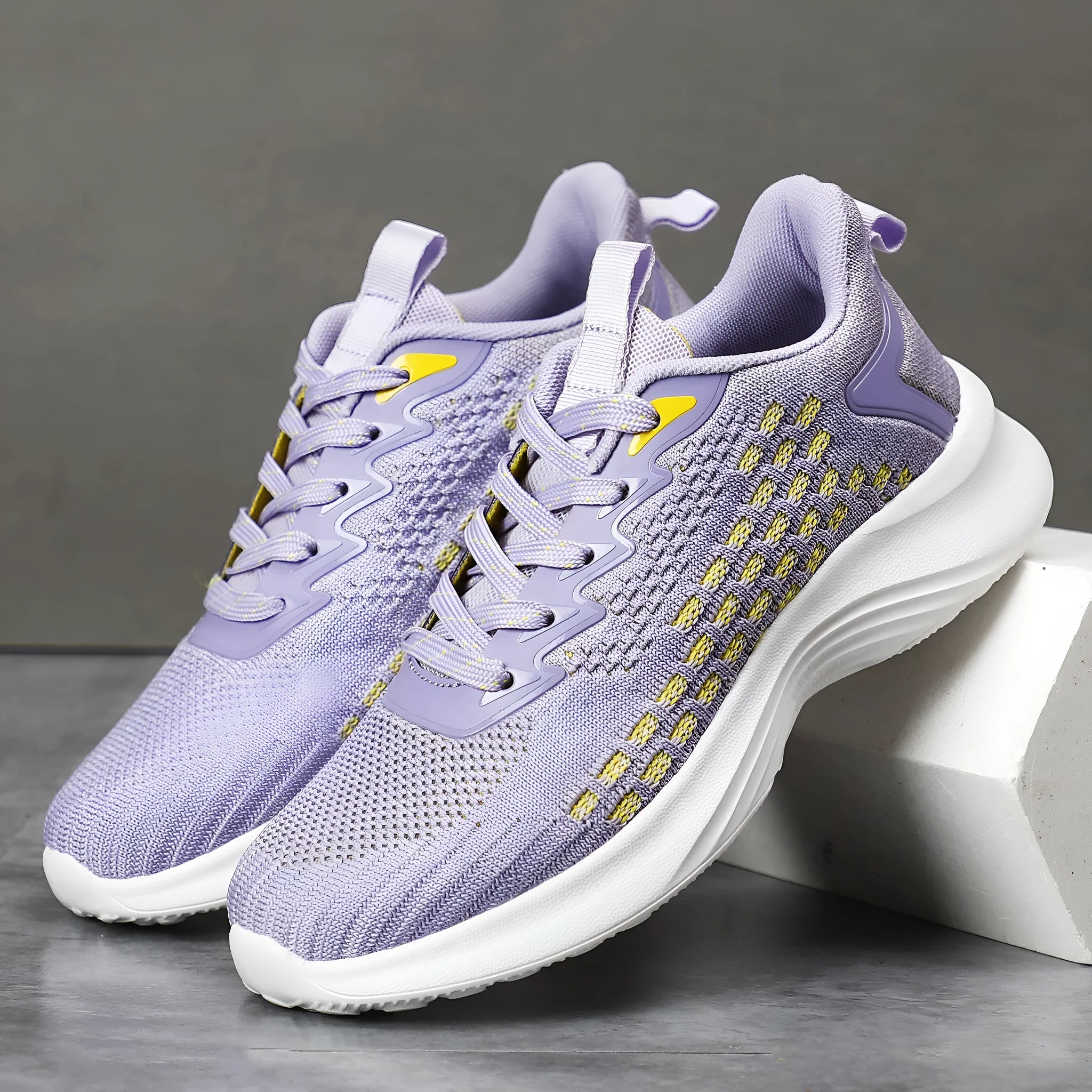 Women's lavender purple Flyknit running shoes with striped pattern and mesh design for sports