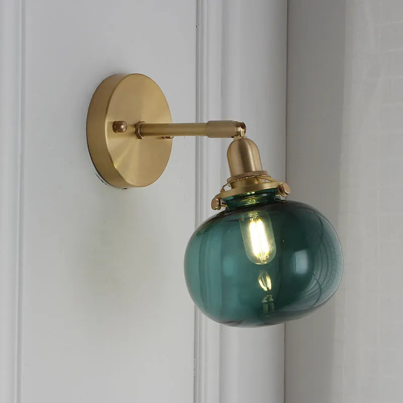Pumpkin-shaped glass wall lamp in a choice of blue, clear, or water ripple transparent finish.