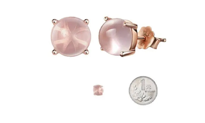 Rose gold coloured drop shape stud earrings with crystal inlay on silver base.