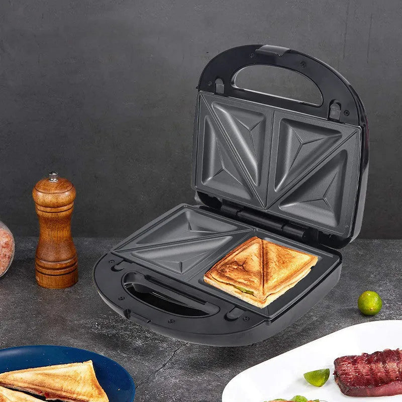 Black electric sandwich pan with double-sided heating, brushed stainless steel cover, and non-stick cooking surface