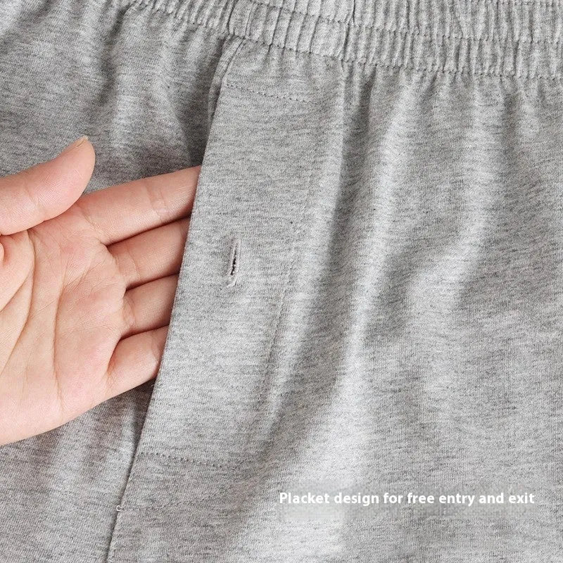 Men's solid-colour pure cotton boxer shorts with a high-waist and loose fit on a plain background.