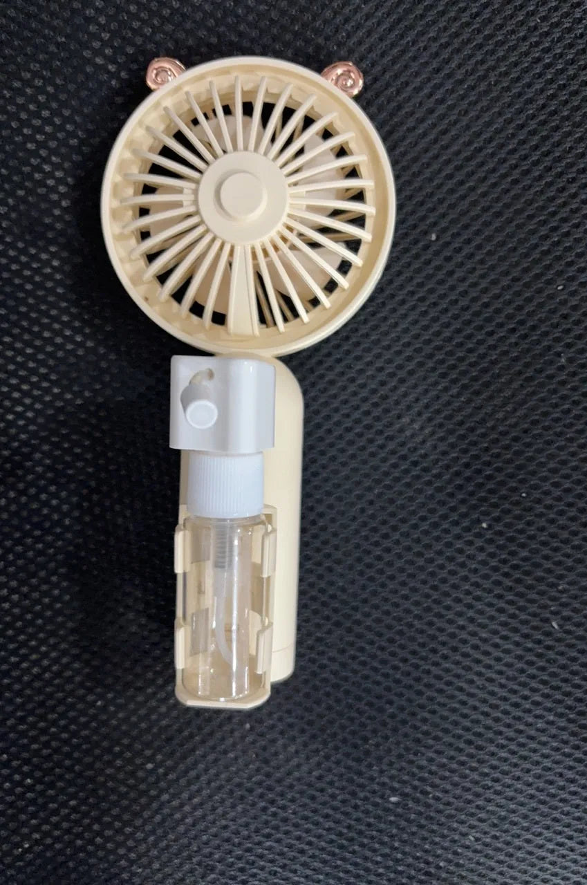 Personalised plastic USB desktop fan in choice of colours on a desk