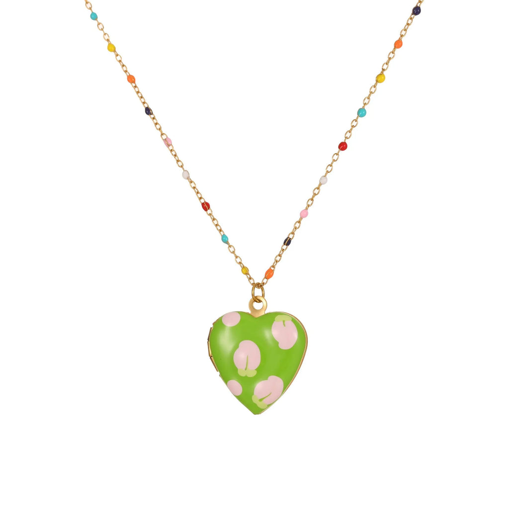Women's stainless steel necklace with 18K gold plating showing heart pendant with fruit designs