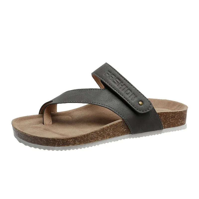 Flat toe ring thick-soled flip-flops in a solid colour on a light background