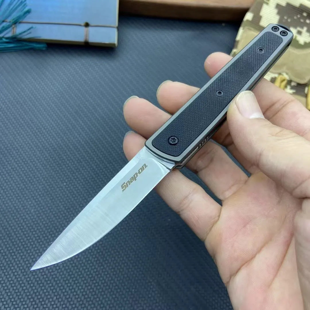 Folding fruit knife with stainless steel blade extended, showing black handle variant with blade measurements
