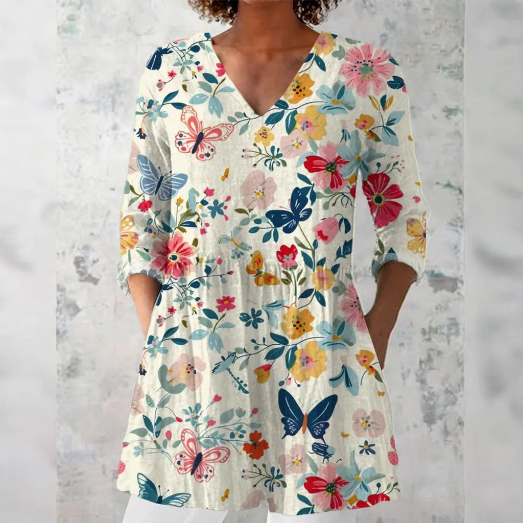 Women's slim-fit long-sleeved retro top with a digital print design on polyester fabric.