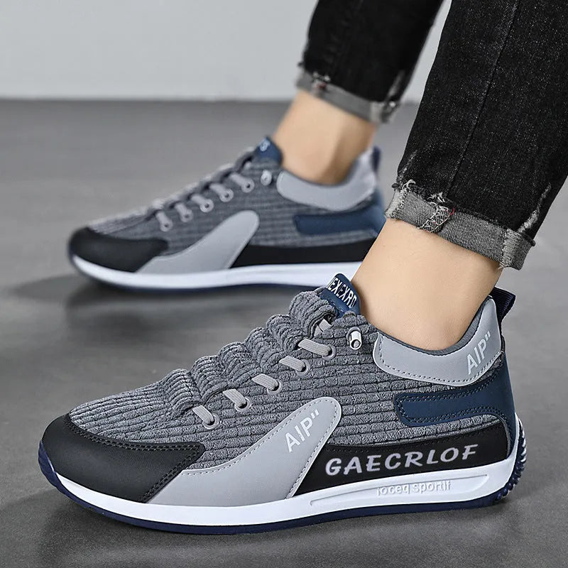 Men's green and grey lightweight mesh running shoes with lace-up front and round toe.
