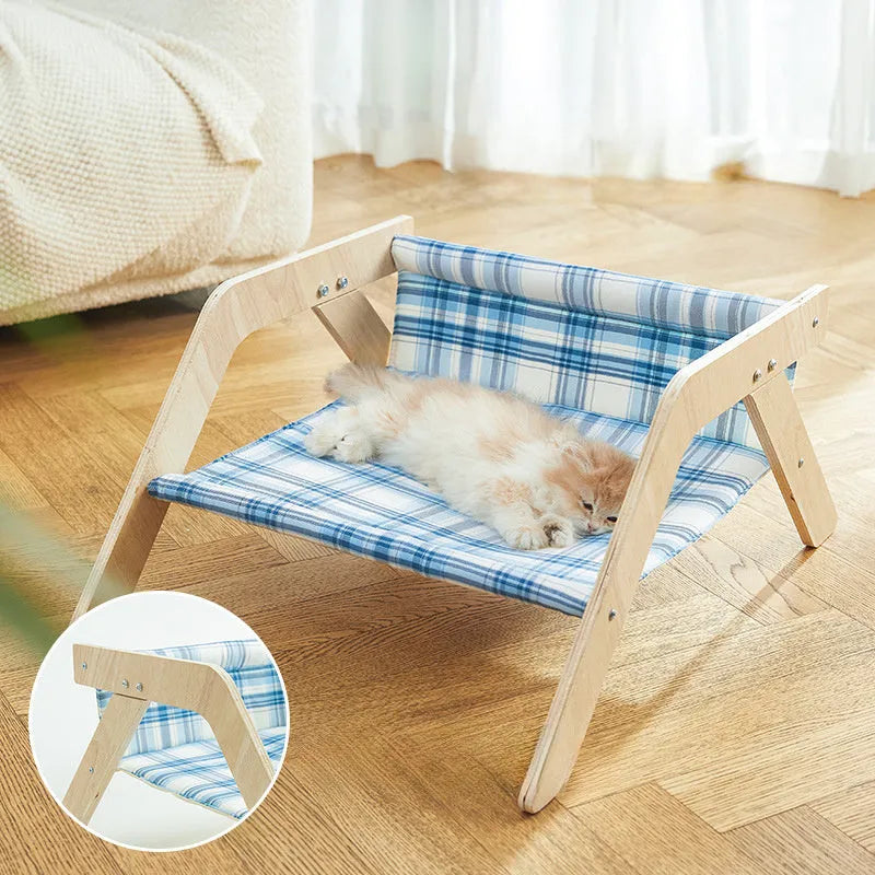 Green wooden elevated cat hammock bed for indoor lounging
