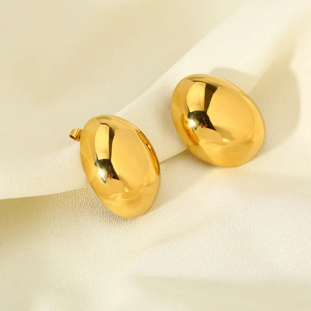 Geometric stainless steel ear studs with a glazed 18K gold electroplated finish and linear design details.