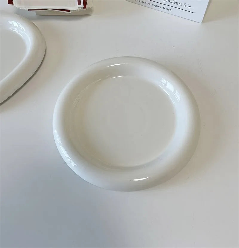 White porcelain plate with bear doodle or round doodle design, shown in 15cm and 20cm sizes.