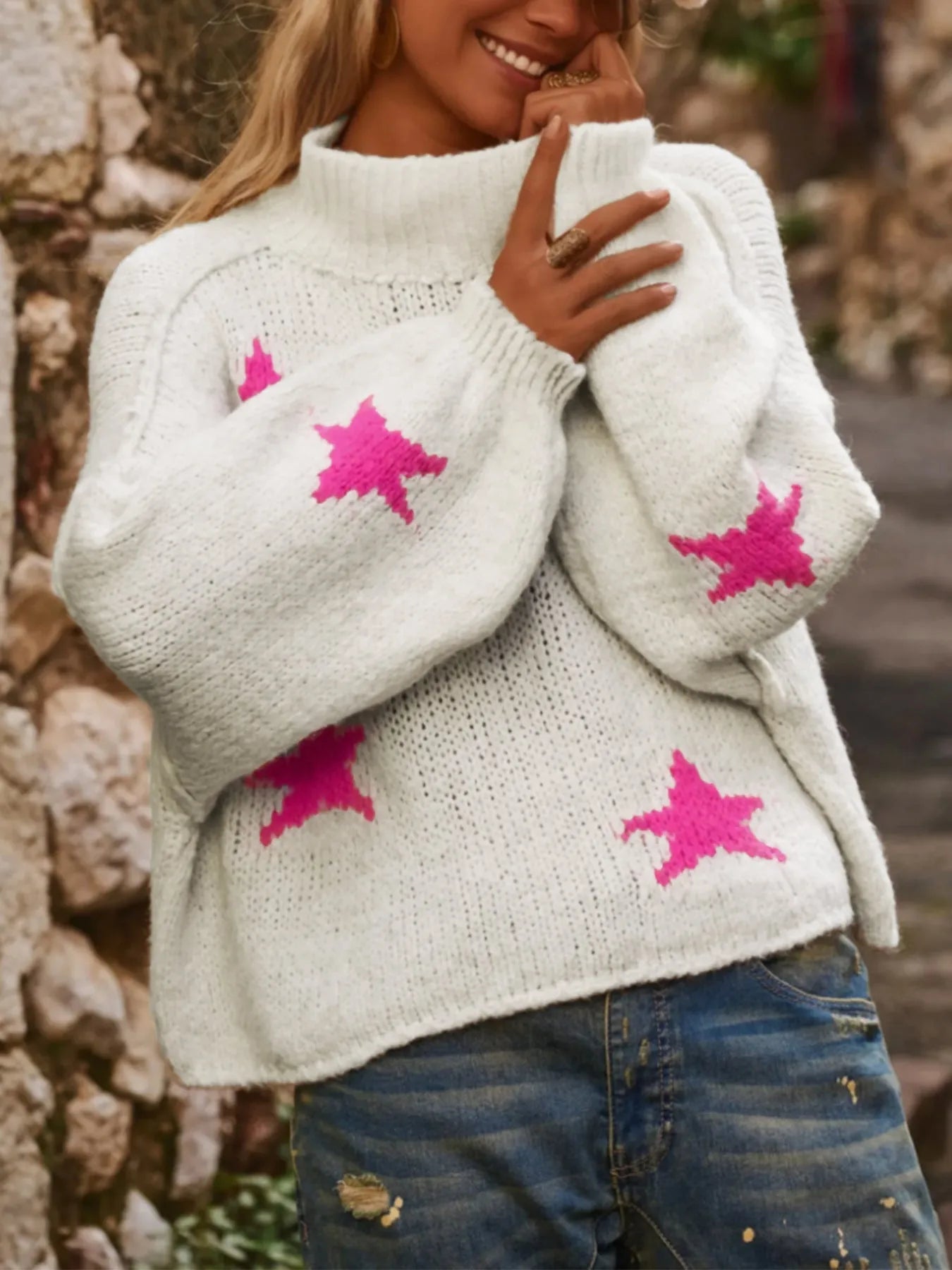 White women's turtleneck pullover with five-pointed star pattern and loose fit design
