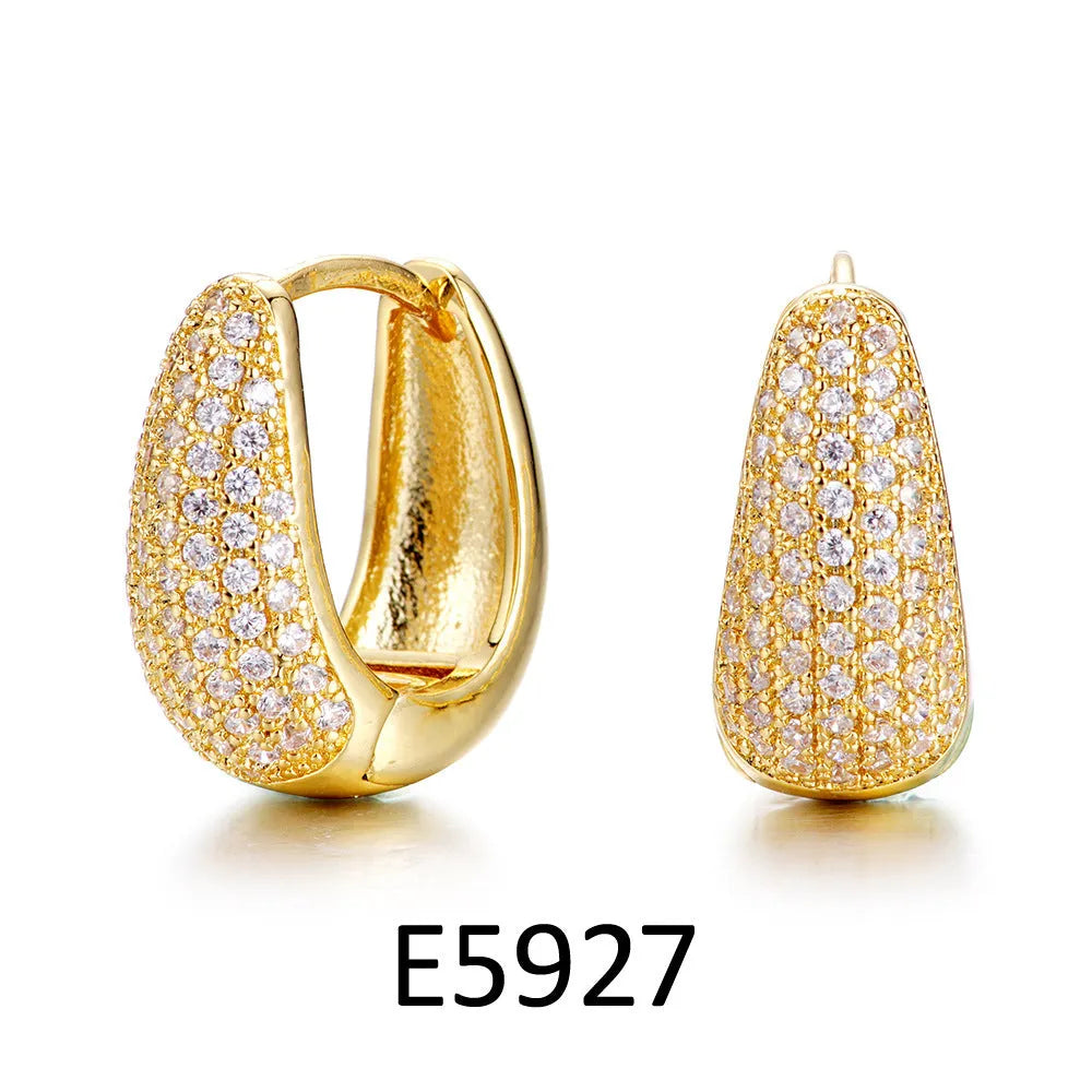 Gold plated heart-shaped zircon ear clip earrings with gang drill elements on copper base