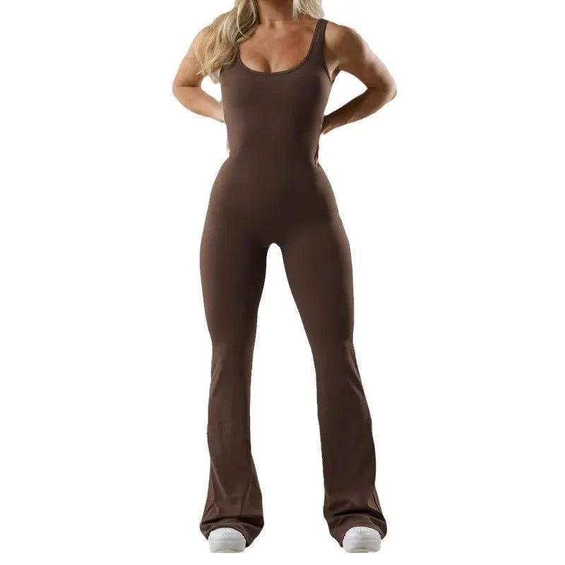Women's black seamless hollow-out yoga bodysuit with built-in bra pads, showing mid-waist and full-length fit.