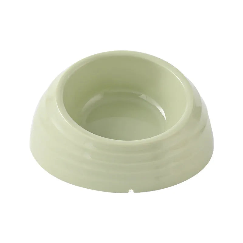 Stainless steel cat bowl with plastic base in beige, brown, or light green.