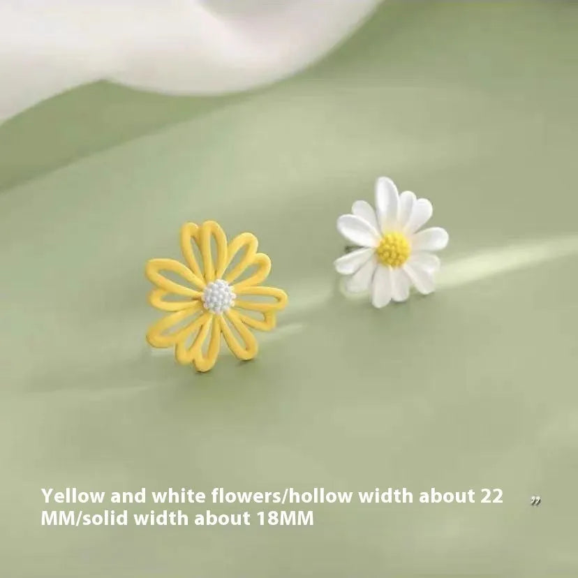 A pair of cartoon-style flower stud earrings in alloy, shown in a two-tone colour option.