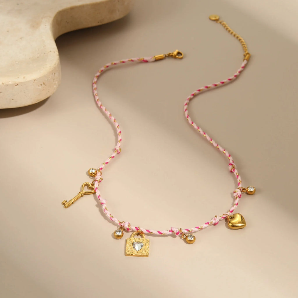 Handmade purple, pink, or blue braided rope and steel necklace or bracelet with heart, star, or geometric pendant.